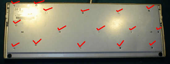 Back of keyboard with screw positions marked